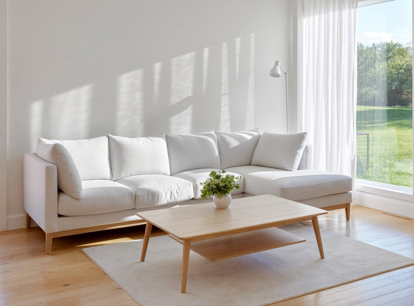 A bright, freshly cleaned living room with sunlight across a polished wooden floor and neatly arranged sofa